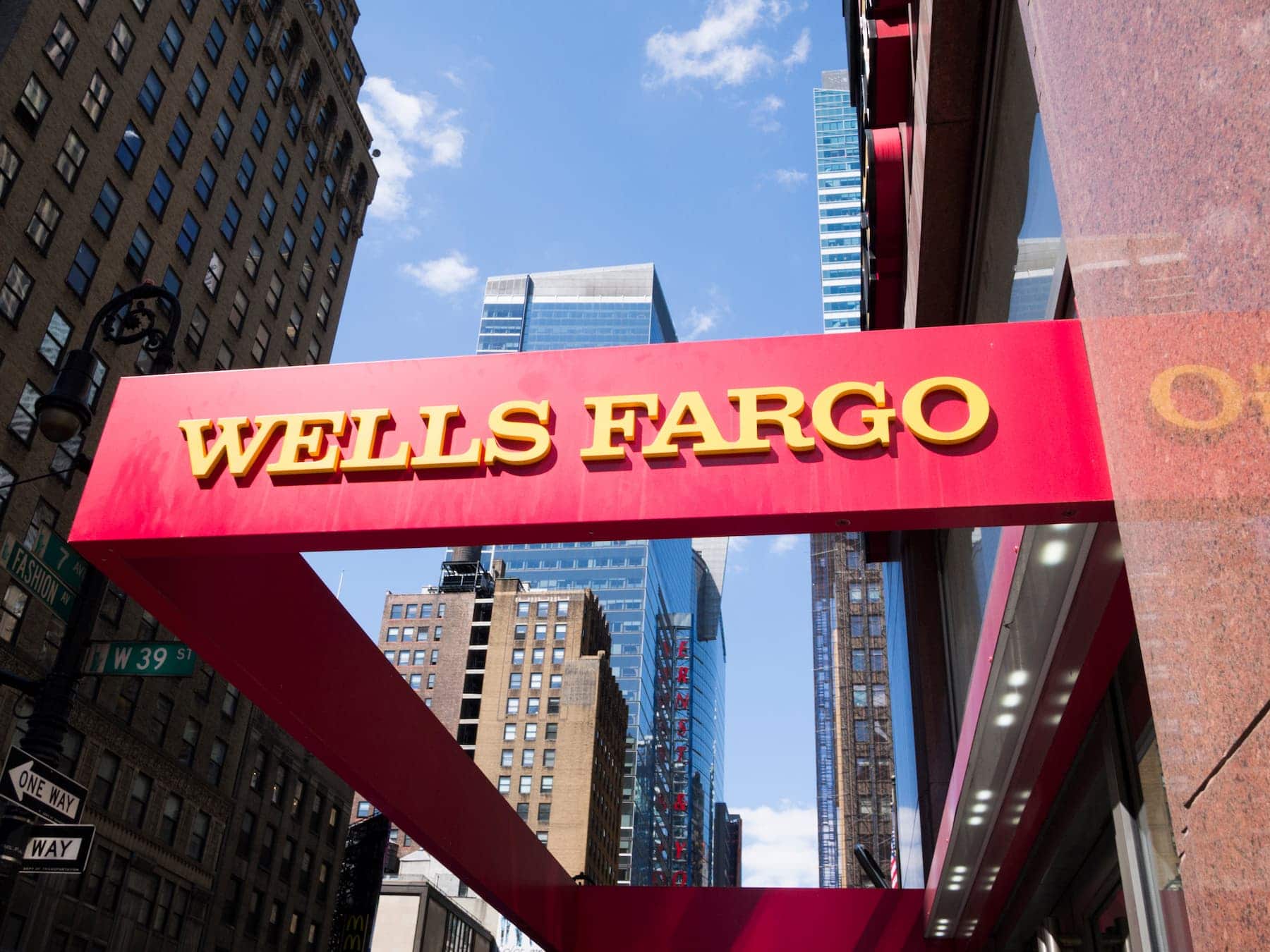 A wells fargo sign in front of a building.